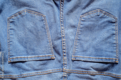 Details from jeans pants with seams and pockets