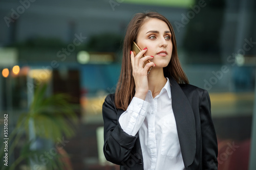 Successful business woman talking on the phone. The concept of the Internet, technology, business, communication and lifestyle