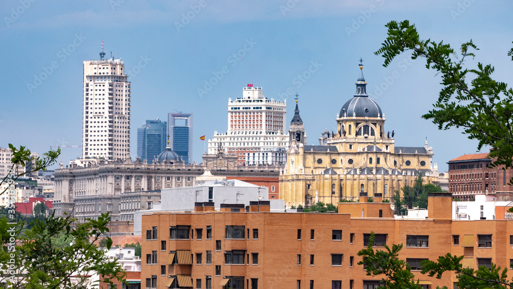 MADRID, SPAIN - APRIL 20, 2020: SKYLINE OF MADRID WITHOUT CONTAMINATION DURING COVID-19. ROYAL PALACE, SPAIN SQUARE BUILDING, TOWER MADRID AND FINANCIAL DISTRICT TOWERS