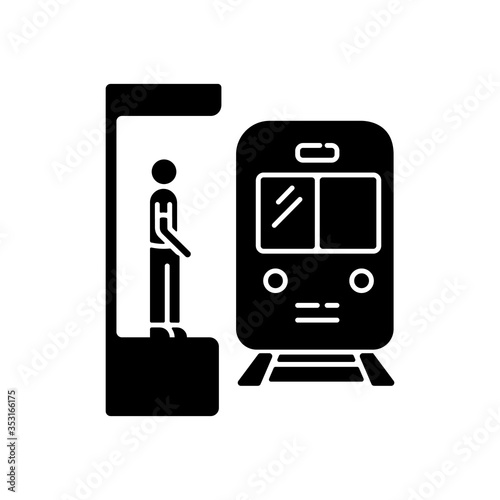 Subway black glyph icon. Railway station. Platform for passenger to wait for metro train. Public commuter. Urban infrastructure. Silhouette symbol on white space. Vector isolated illustration