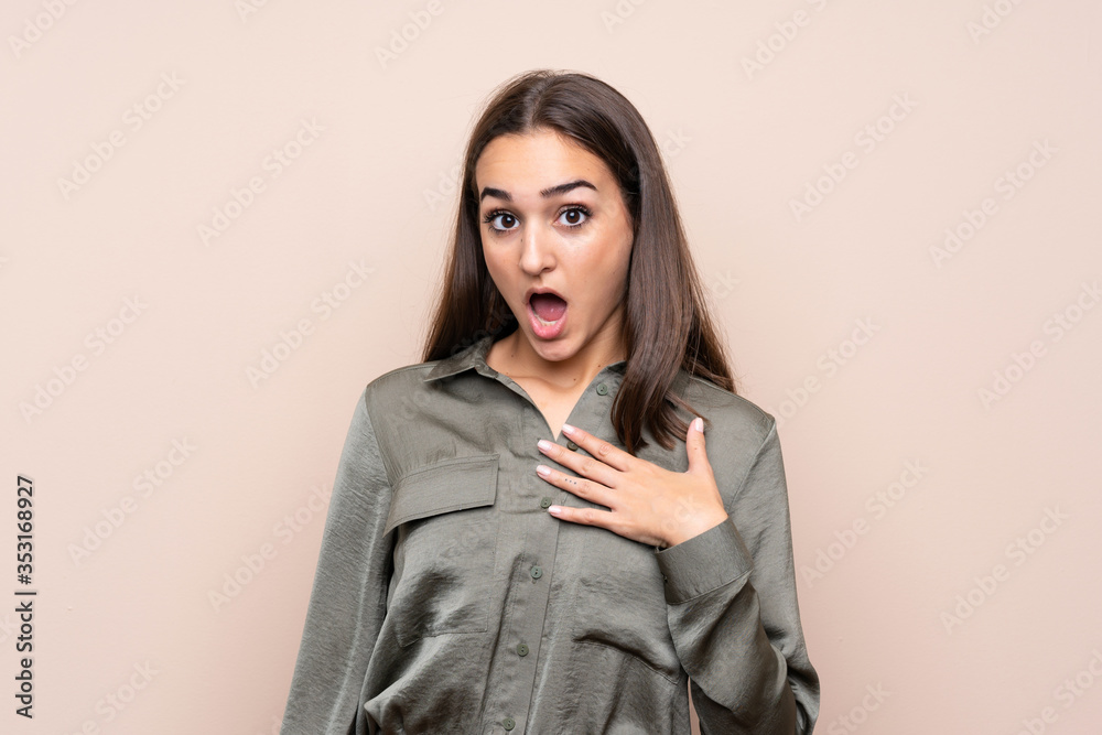 Young girl over isolated background surprised and shocked while looking right Young girl over isolated background surprised and shocked while looking right