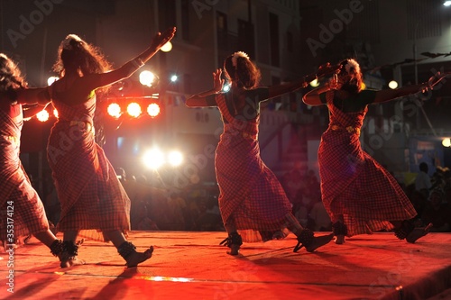Indian Bharathanatyam dancers on stage photo