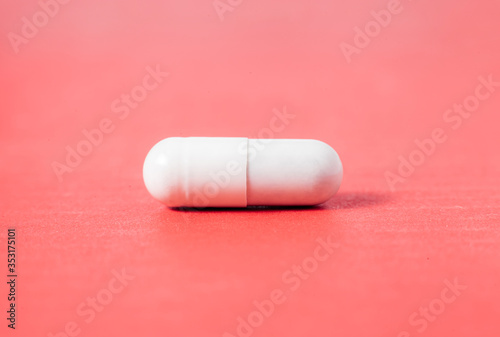 Capsule pill Medicine Positive Coronavirus or COVID-19.Medicine Of viruses in laboratory for Prevention of a pandemic in Wuhan China. scientist in biological protective Epidemic virus outbreak concept photo