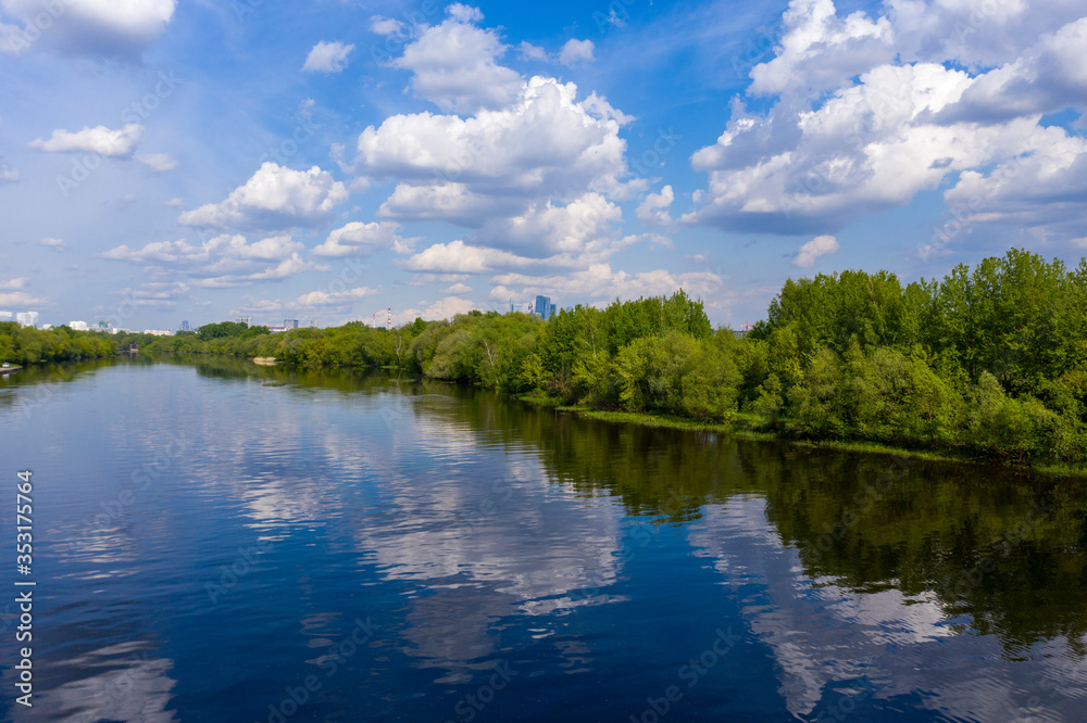 panoramic views of the river with a forest and reflection of clouds in the river taken from a drone panoramic views of the river with a forest and reflection of clouds in the river taken from a drone