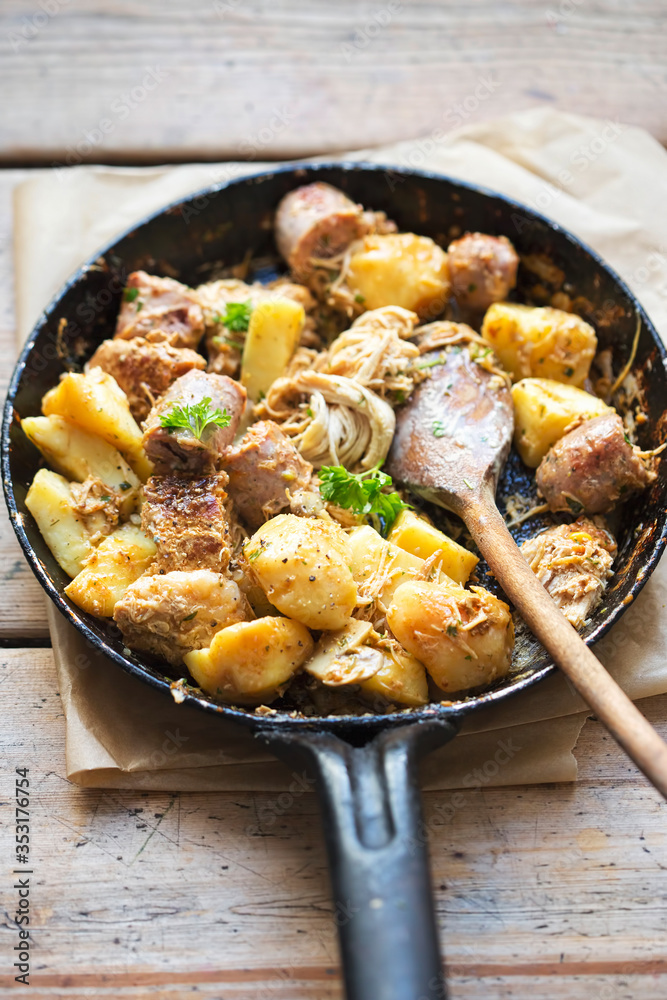 Leftover dinner. Roasted chicken, sausages, potatoes with parsley Leftover dinner. Roasted chicken, sausages, potatoes with parsley