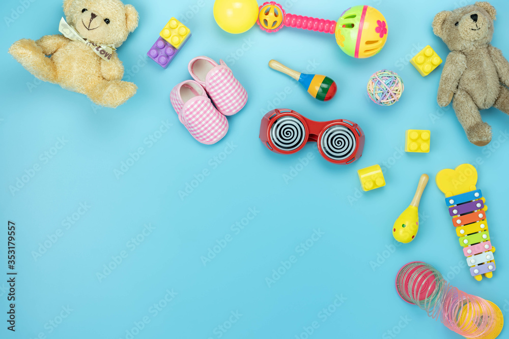 Table top view decoration kid toys for develop background concept.Flat lay accessories baby to play with items child on modern blue paper at office desk.Copy space for add text.pastel tone wallpaper.