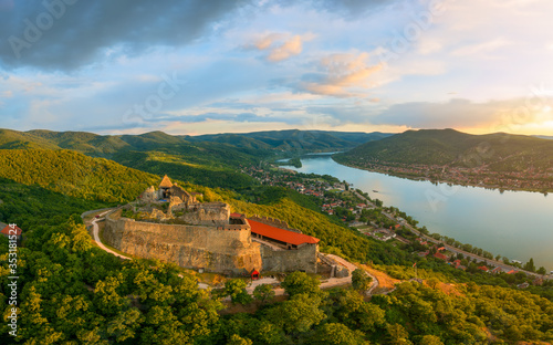 Amazing aerial landscapes about the Visegrad Castle in Hungary.  Fantastic historical castle ruin in Danube bend. Populad tourist destination photo