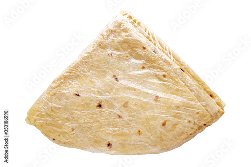 Pita bread in plastic bag isolated on white background. Pita bread. National cuisine. 