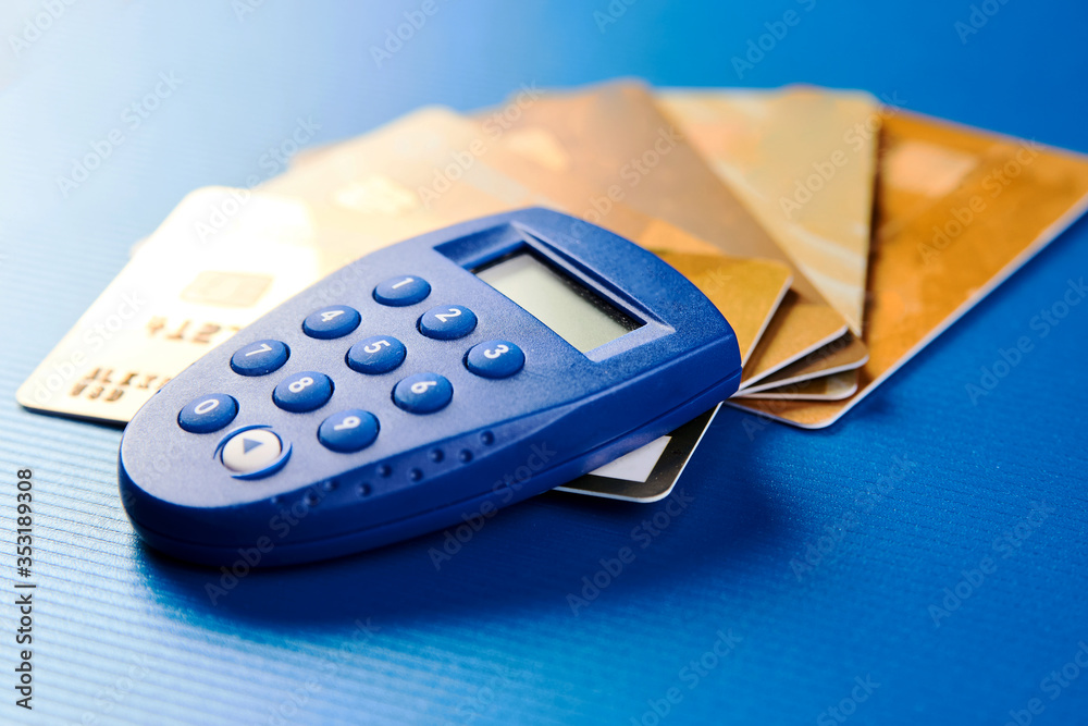 Secure wireless payment concept. Gold credit cards and security remote
