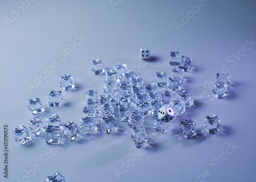 Set of ice cubes and dice falling on them,