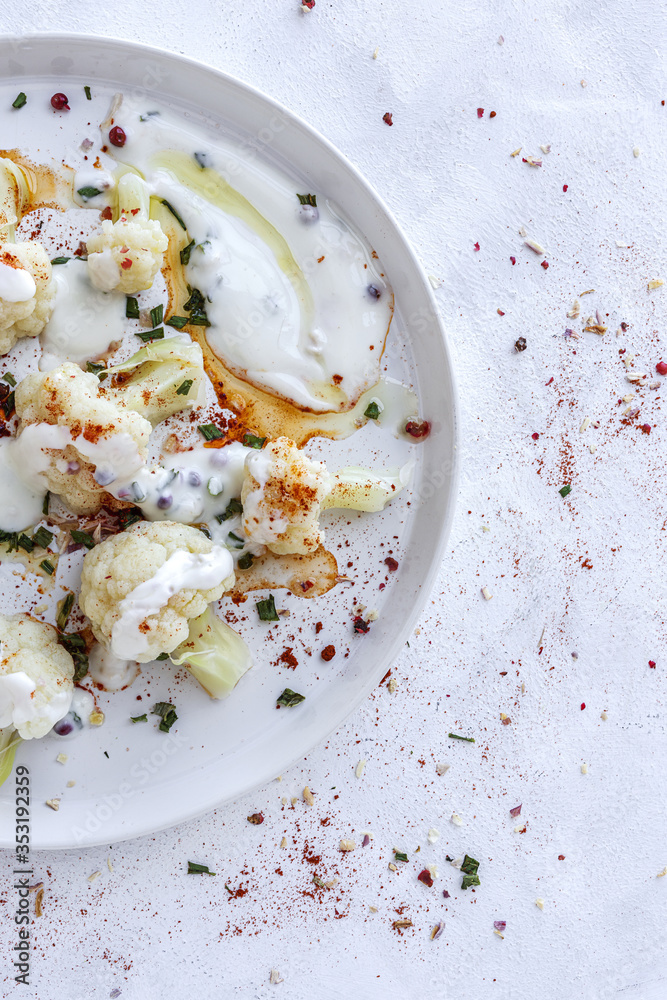 Cauliflower salad with spices and olive oil from above Cauliflower salad with spices and olive oil from above