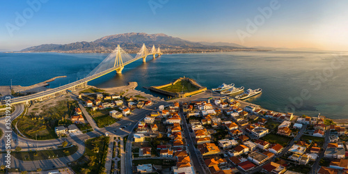 Wide panorama of world famous  Rio - Antirio Harilaos Trikoupis bridge at sunset time photo