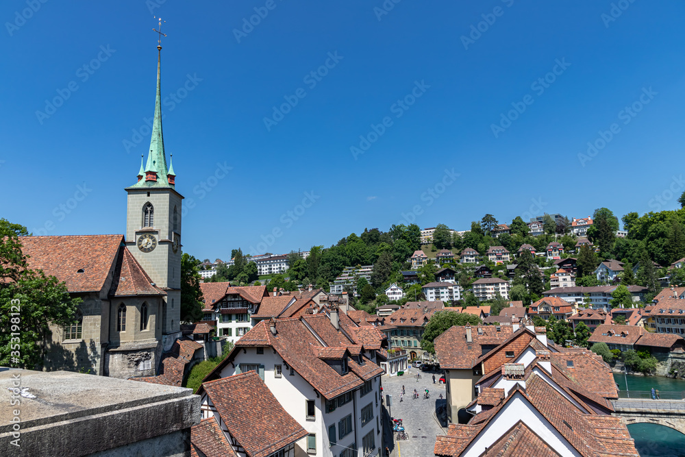 A row of houses and Nydeggkirche in Bern Switzerland near Aare river