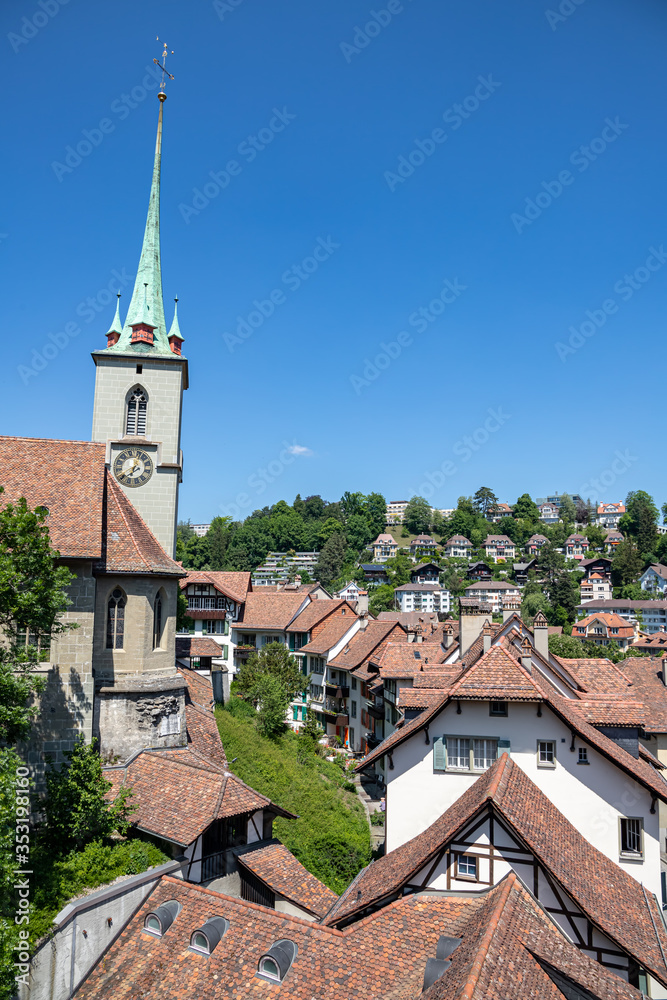 A row of houses and Nydeggkirche in Bern Switzerland near Aare river