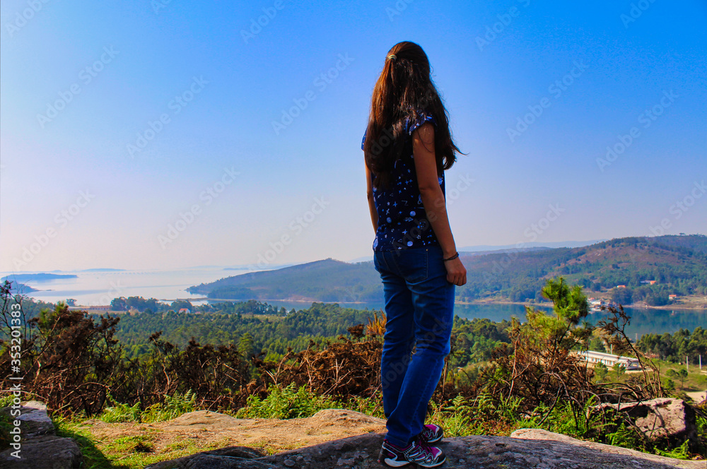girl on the top of the mountain with view over Ria de Arousa