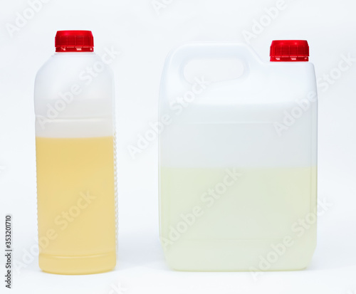 Foto set for creativity epoxy resin in plastic canister and solvent in plastic bottle