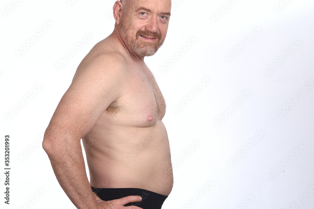 portrait of a man shirtless on white background, side view