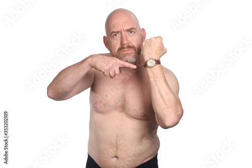 angry man pointing the time on white background photo