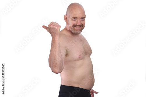 shirtless man pointing with thumb on white background