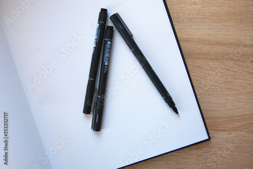 Pens on a notepad