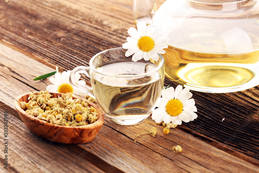 chamomile cup of tea with chamomile flowers on wooden rustic table chamomile cup of tea with chamomile flowers on wooden rustic table