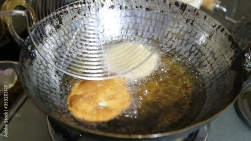 Deep frying puri ( poori ) Recipe in indian kitchen