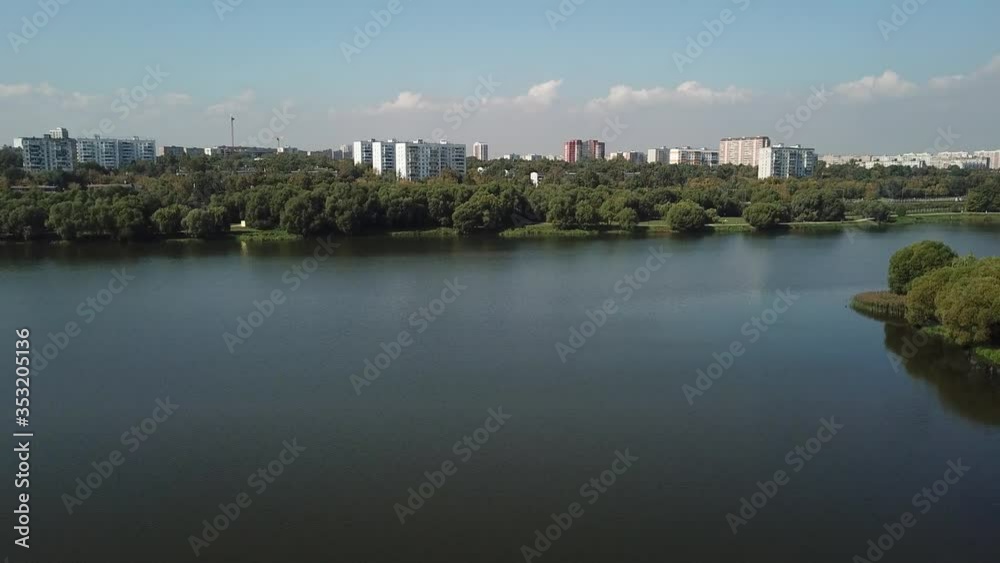 4K quality aerial video scenic view of kite festival, green park, distant city and hills in Kolomenskoye area on sunny summer day near Moscow River in Moscow, Russia 4K quality aerial video scenic view of kite festival, green park, distant city and hills in Kolomenskoye area on sunny summer day near Moscow River in Moscow, Russia