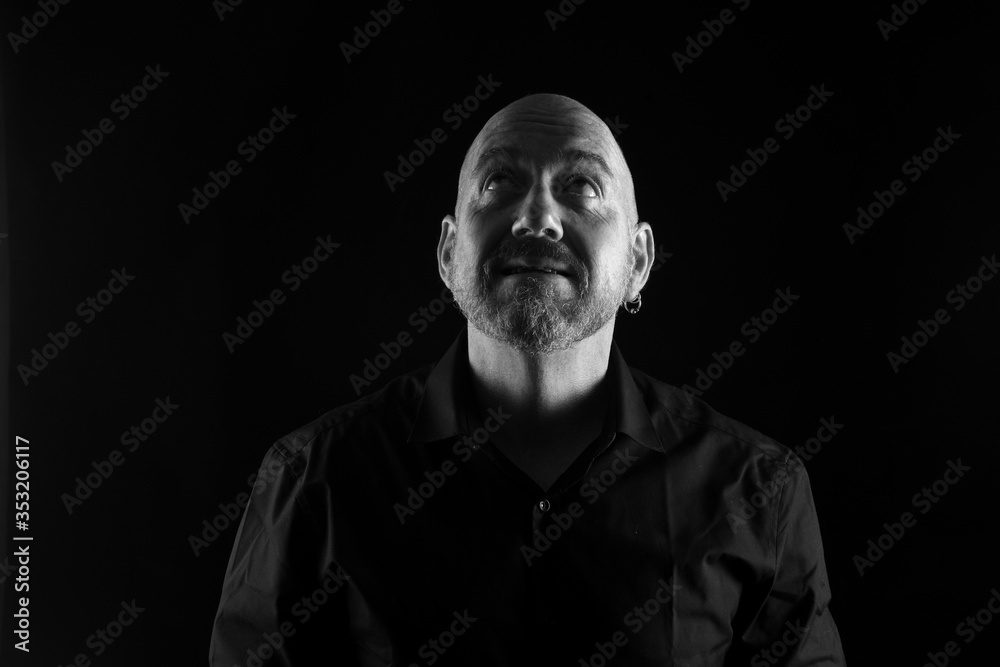 portrait of a man in low key, look up and black and white portrait of a man in low key, look up and black and white