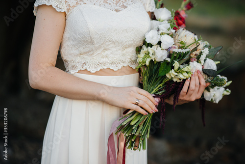 Beautiful and sophisticated wedding bouquet close-up holds the bride in her hands. Wedding bouquet