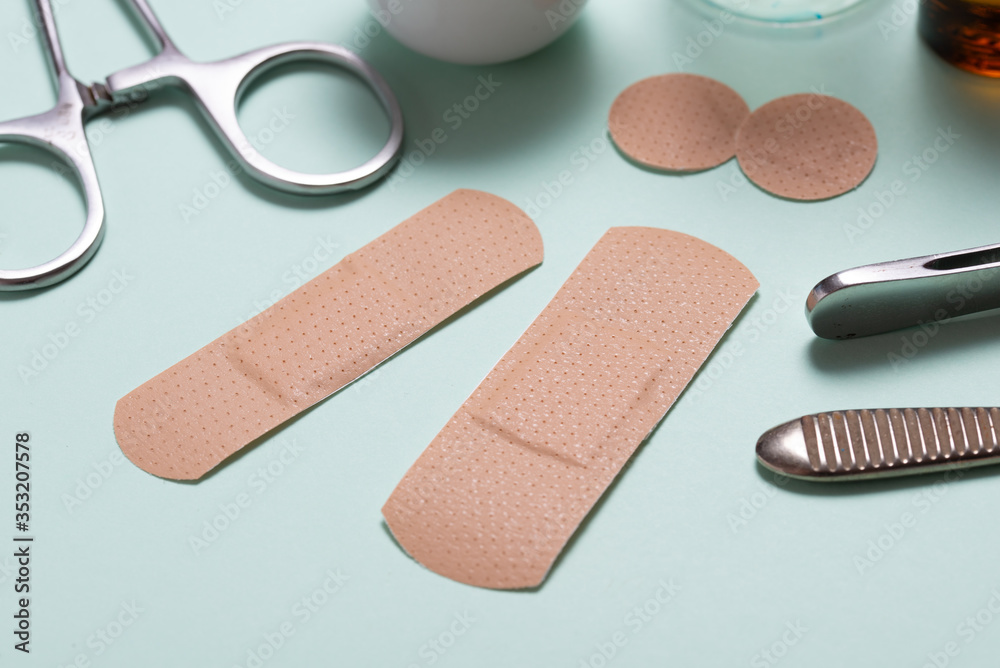 Set of adhesive bandage, medical sticking plaster on green background Set of adhesive bandage, medical sticking plaster on green background