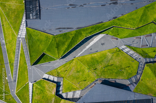Katowice city center architecture. Aerial view of green grass terraces. Upper...