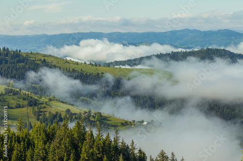 Majestic view on beautiful fog mountains in mist landscape. Travel background. Exploring beauty world. Carpathian mountains. Ukraine. Europe.