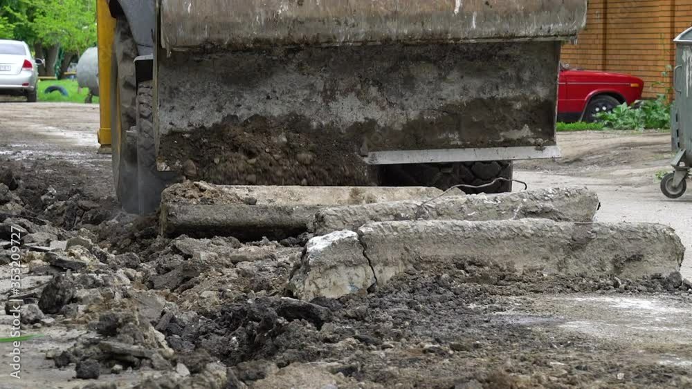 Road works with bulldozer removing old border Road works with bulldozer removing old border