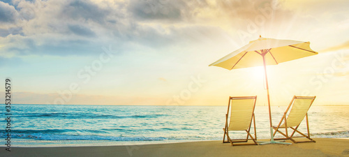 Background with couple of deck chairs at sunset, Travel concept, Summer background