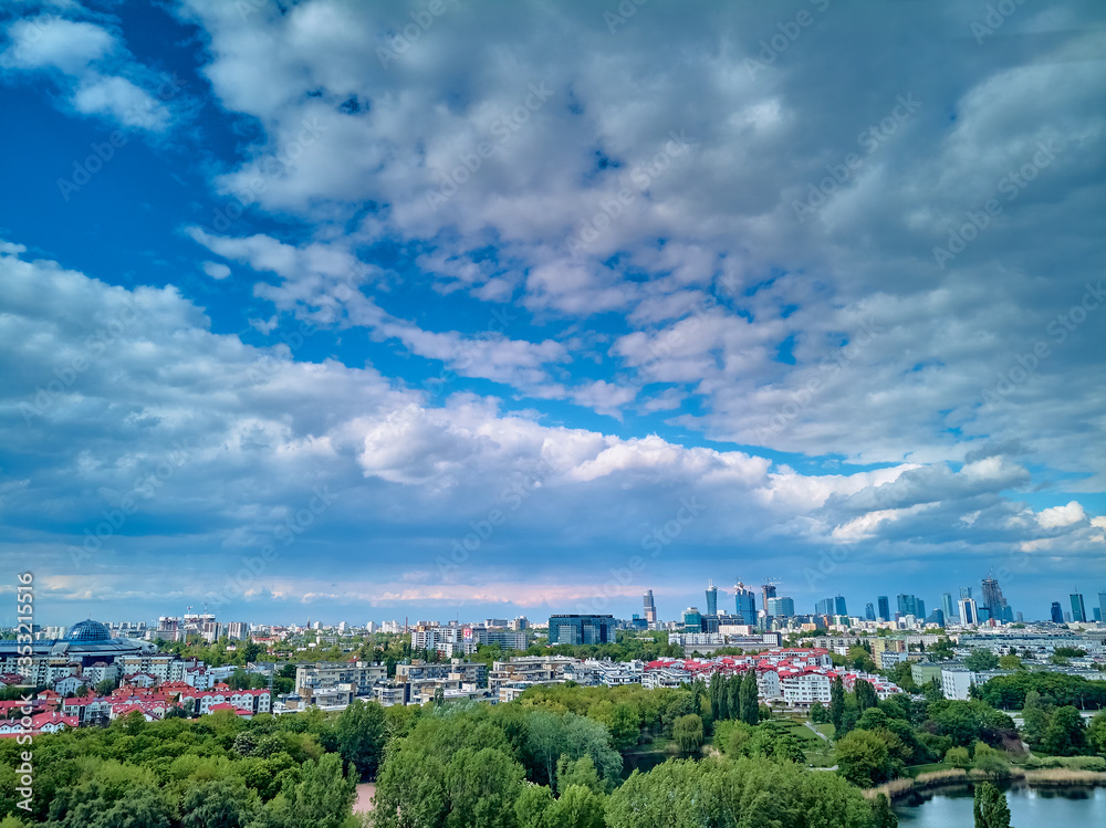 Fototapeta premium A beautiful panoramic view of the sunset in a fabulous evening on Szczesliwice Park - a former village, currently a housing estate in the Ochota district in Warsaw, Poland