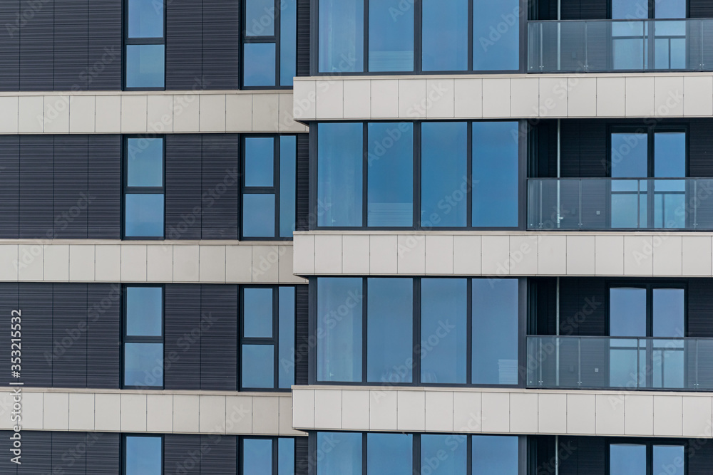 part of the facade of a modern residential building. Modern architecture made of glass and concrete. part of the facade of a modern residential building. Modern architecture made of glass and concrete.