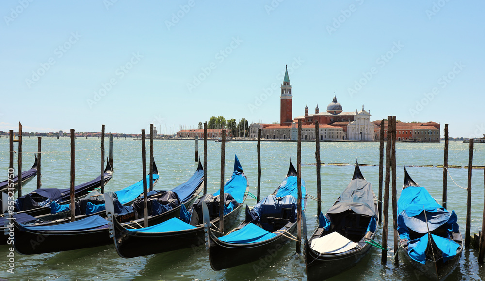 many gondolas moored on the Venetian Lagoon