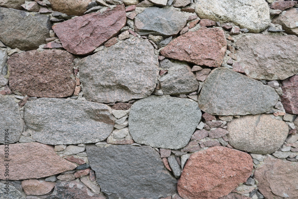 Fototapeta premium Old stone wall. Mosaic of large stones