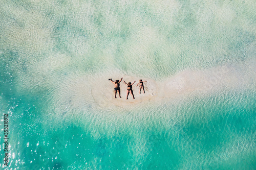 Young beautiful family with a child on a tropical vacation.mauritius island photo