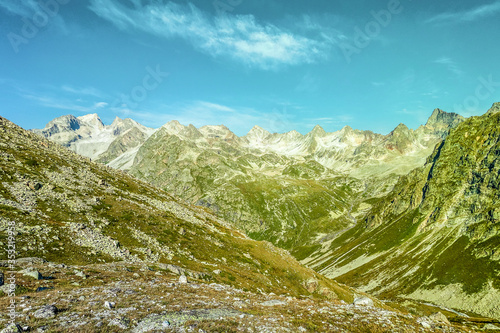 Picturesque mountain scenery with cumulus clouds. Wildlife. Hiking. Daytime. journey, tour, trip