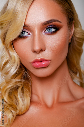 Gorgeous bride with luxurious twinkling make-up in brown and pink-purple hues. Makeup Details. Thick and long eyelashes. Nude Lipstick on Plump Lips. Closeup portrait girl. perfect makeup for bride   