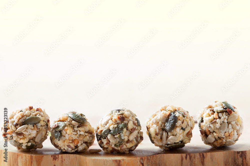 Home cooking dates energy homemade organic seeds nuts vegan oatmeal balls row rustic copy space background Home cooking dates energy homemade organic seeds nuts vegan oatmeal balls row rustic copy space background