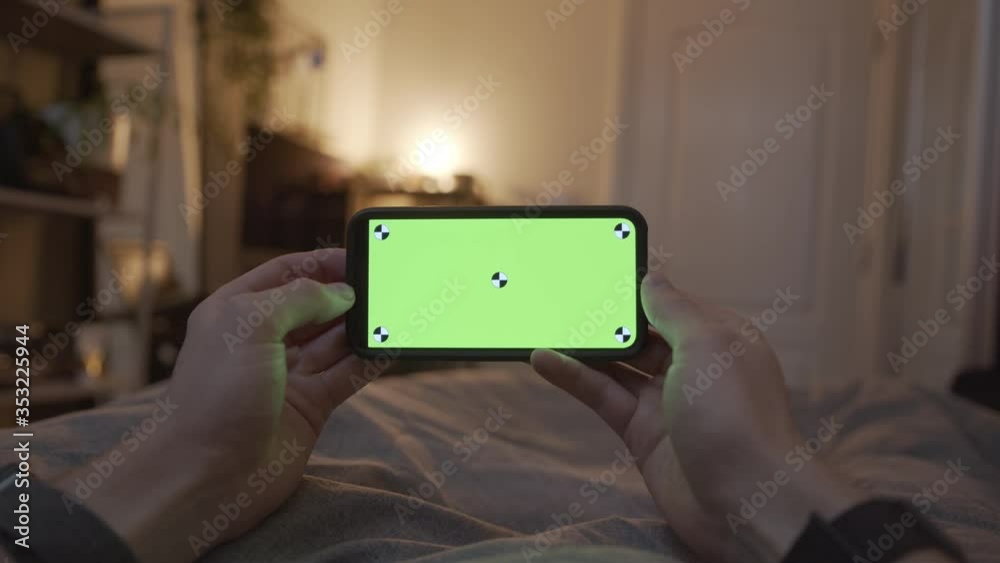 POV of a Person Watching a Video on a Green Screen Smart Phone Whilst in bed POV of a Person Watching a Video on a Green Screen Smart Phone Whilst in bed