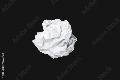 White throwing paper lies on a black background.