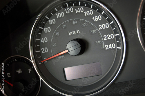 A close up of a car speedometer