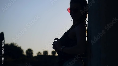 Woman tourist posing in colonnaded street of ancient greek agora in Side, Turkey photo