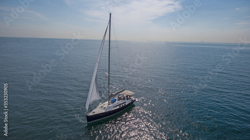 Sailboat cruising on the sea. 