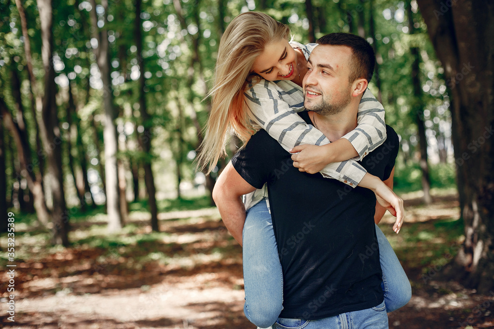 Fototapeta premium Couple in a forest, warm summer, lovely weather