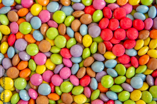 Close up view of a multicolore sweet round candies display in a grocery shop