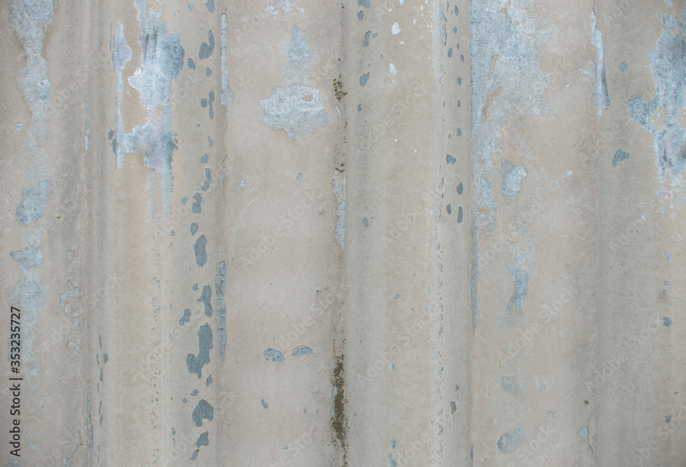 Stained corrugated galvanized iron plate texture. Peeling paint metal fence surface background close up Stained corrugated galvanized iron plate texture. Peeling paint metal fence surface background close up